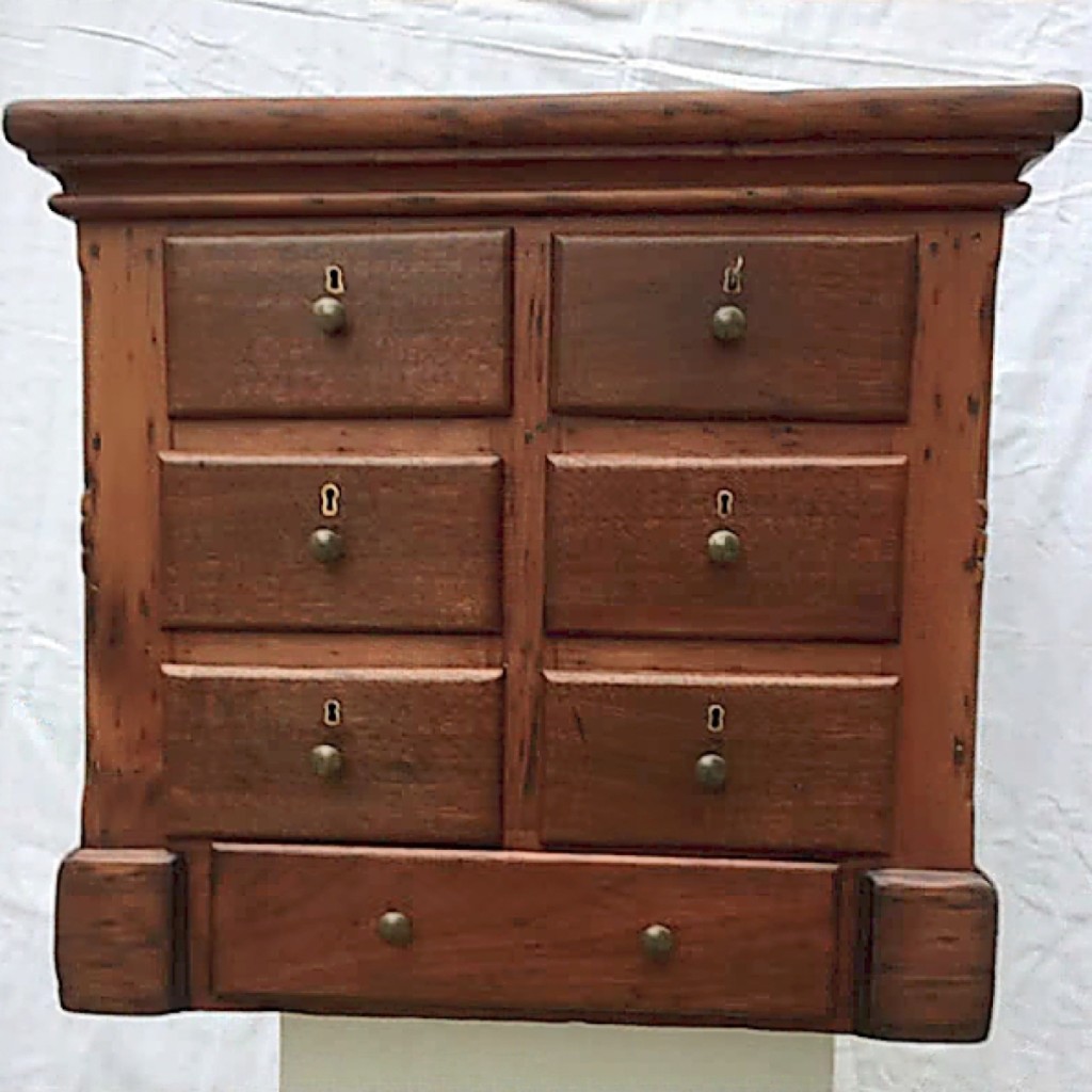 Period furniture was offered by Martin J. Ferrick Antiques, Lincolnville, Maine, including this Nineteenth Century multi-drawer apothecary cabinet in pine and walnut with locking drawers.