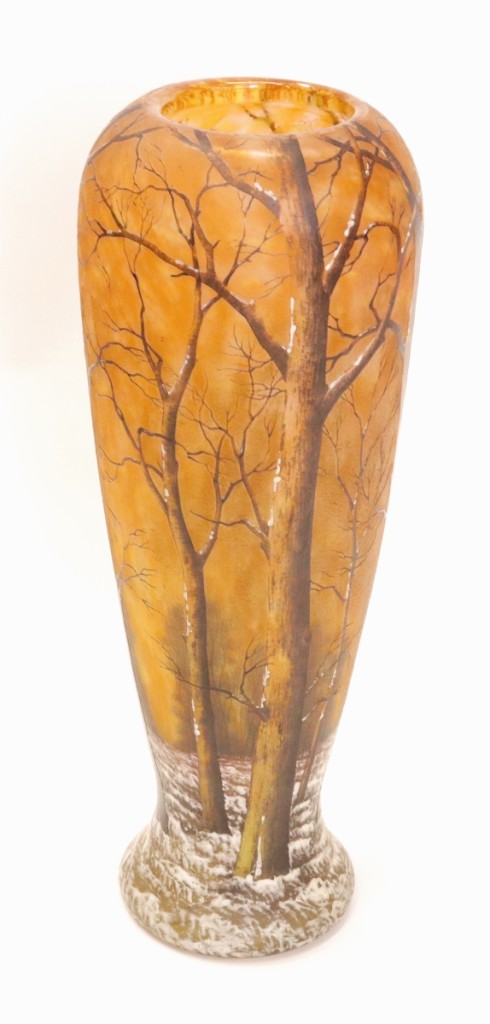 Rare and mottled in yellow, orange and white hues, this Daum Nancy winter scene vase reached $5,845.
