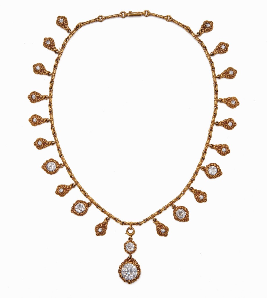 Selling for $43,750 was this 18K gold and diamond necklace. The fancy-link necklace suspended a removable central drop with two diamonds, one of which weighed 3.60 carats, plus 20 drops, each with old mine-cut diamonds.