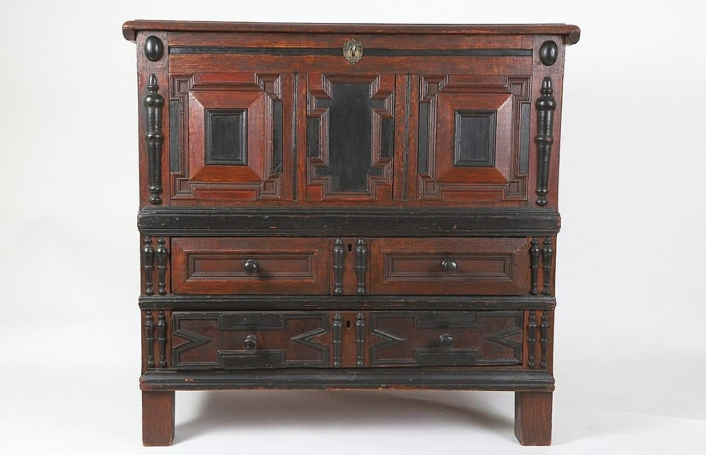 Top honors of the Bonney collection went to this Pilgrim century two-drawer oak blanket chest with three panels and ebonized spindles that finished at $30,000.