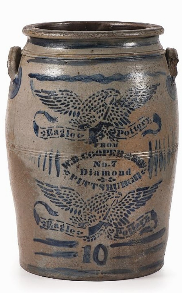 Profuse stenciled decoration pushed this 10-gallon crock to $7,500. It is marked for W.D. Cooper & Bro, a Pittsburgh outfit in the Nineteenth Century. Around the stenciled work is freehand decoration, including the number 10 and the applied squiggle lines to the top and bottom.