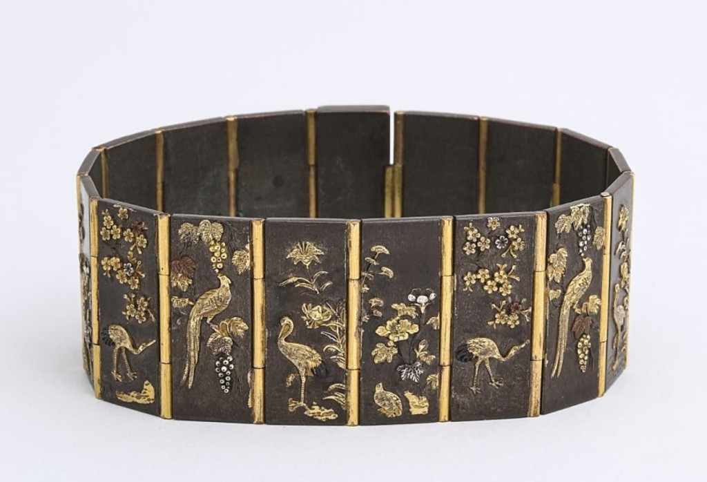 This Meiji period (1868-1912) Shakudo plaque bracelet was with James Robinson, Inc., New York City. According to the entry notes, it was fashionable during the Victorian era to export Shakudo to the American and European markets, where it was mounted as jewelry and on other decorative objects.