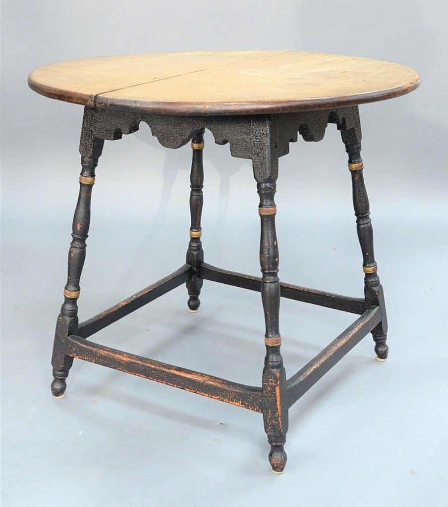 Rising to $18,000 was this early Eighteenth Century tavern table with a round maple top on scalloped apron set on turned splayed legs and box stretchers. Diana Atwood Johnson Collection.