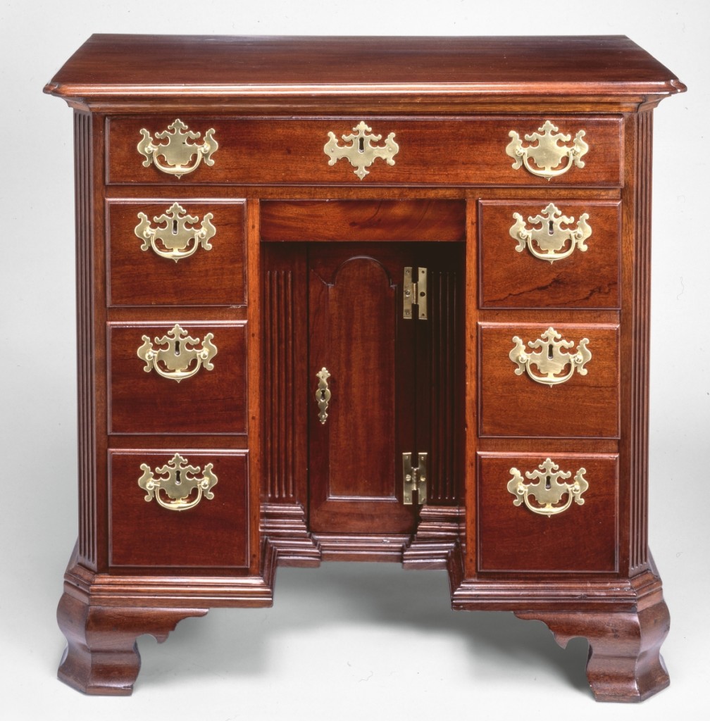 Bureau table, Philadelphia, 1750-55. Mahogany, white cedar, tulip poplar, brass; 33 by 34½ by 18½ inches. Promised gift of the McNeil Americana Collection. Bureaus (or “buroes”) appeared regularly in advertisements and inventories in Philadelphia from the 1750s to 1780s. The cabinetmaker Thomas Affleck made one for Levi Hollingsworth as late as 1783. Surviving bureau tables from Boston and Newport have writing desks in the top drawers, while this one does not.