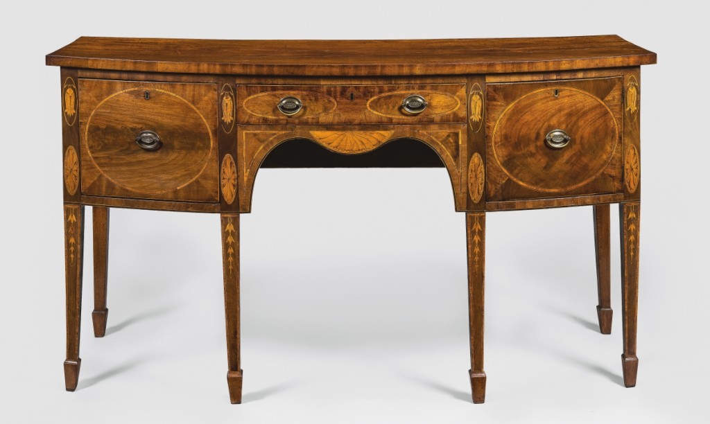 Sideboard attributed to John Bankson (1754-1814) and Richard Lawson (1749-1803), Baltimore, circa 1799. Mahogany, mahogany veneer, tulip poplar, dark- and lightwood string inlay, satinwood, brass; 39 by 105 by 26½ inches. Gift of Virginia Dilkes Hart, 1964-112-1. According to family history, this sideboard — which embraces British Neoclassical design while also exhibiting Baltimore touches — was purchased in 1799 as part of the wedding furniture of William Norris (1774-1833), an entrepreneur from Lancaster, Penn., and his wife, Sarah Schaeffer Norris (1783-1852), of Baltimore.