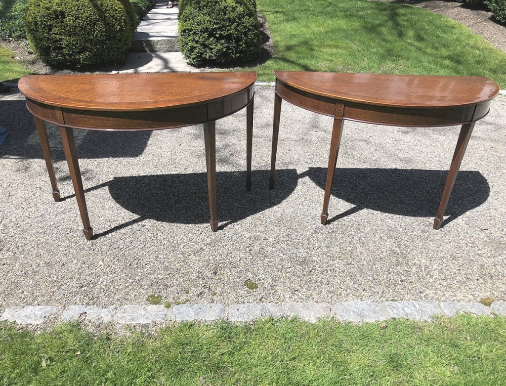 Two matching English demilune tables hit $2,880.