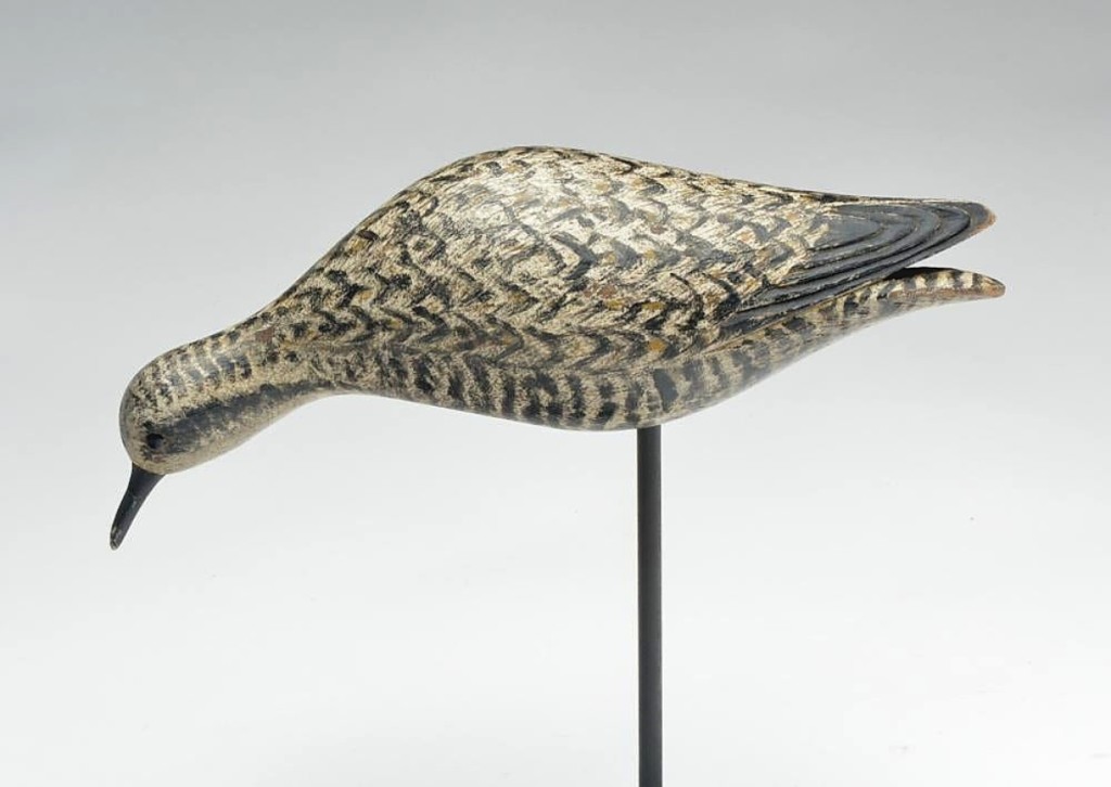 At $108,000, this Elmer Crowell feeding golden plover with carved wings, split tail, in fall color, was the highest priced lot in the sale. Perhaps no more than five of these particular decoys exist and it had everything that an advanced collector would find desirable.