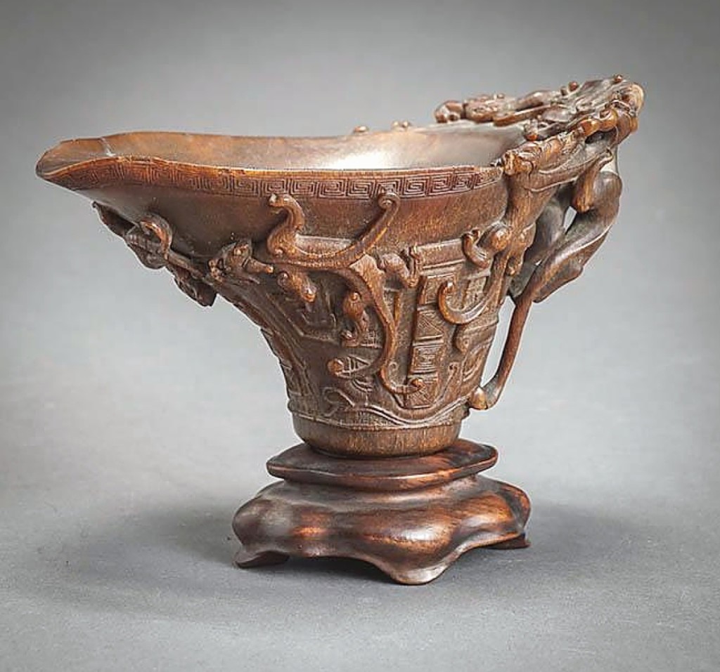 In Chinese tradition, libation cups made of rhinoceros horn are considered to be magical objects, thought to contain aphrodisiac properties and able to detect poison. This Seventeenth-Eighteenth Century heavily carved example sold for $39,650.