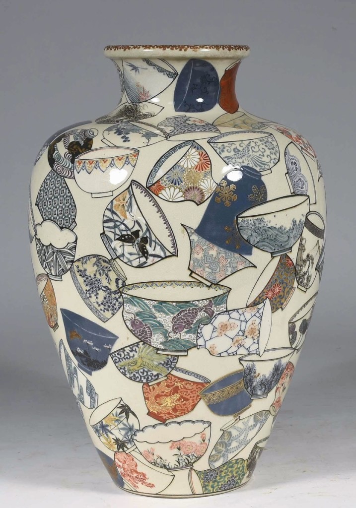 Although the high estimate was $500, this Japanese porcelain vase was decorated with numerous teacups and sold for $10,200. It was 17 inches tall and cataloged as signed but not further identified.