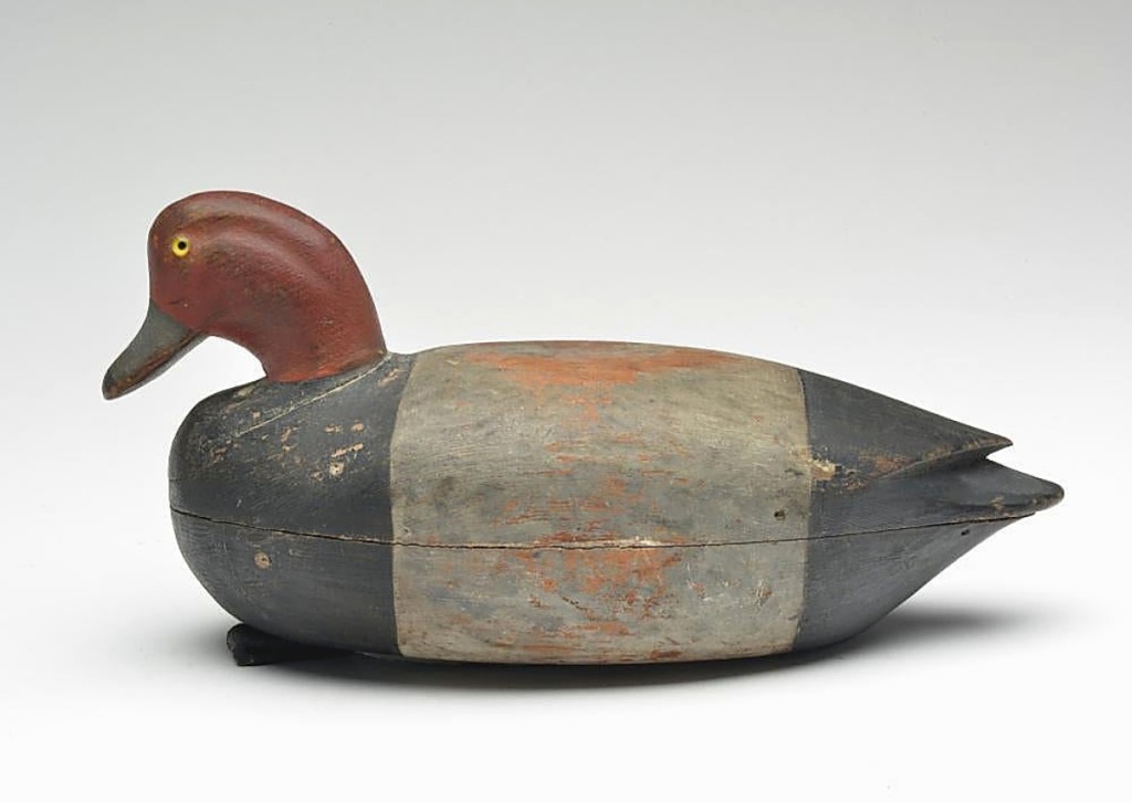 Decoys made by members of the Cobb family of Cobb Island, Va., are among the most desirable. This hollow carved redhead drake by Nathan Cobb Jr had an inlet head and carved wing tips. It is pictured on page 218 of Chesapeake Bay Decoys and it realized $55,200.