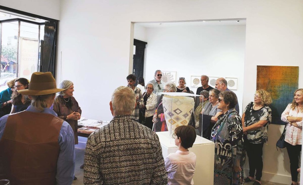 Carol Sauvion’s vision for Craft in America grew from expertise acquired at Freehand Gallery, which she founded in Los Angeles in 1980. Here, Sauvion, left, speaks to a group in the Craft in America Center galleries.