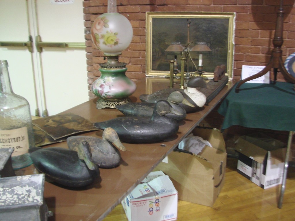 Cape Cod dealer Hilary Nolan had an assortment of decoys. The large eider at the far right had been made by Sam Collins, Essex, Conn. The two black ducks were priced at $500 each.