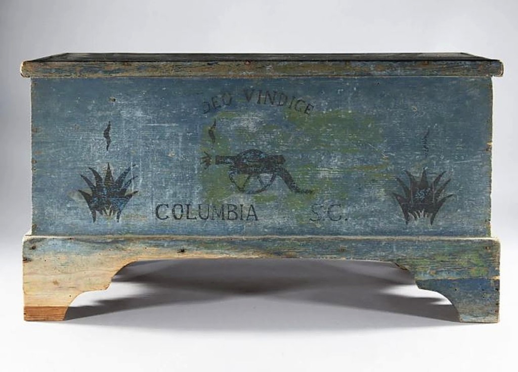 Selling for $2,714 was a Columbia, S.C., paint-decorated blanket chest with the Confederate motto Deo Vindice appearing over a firing cannon.