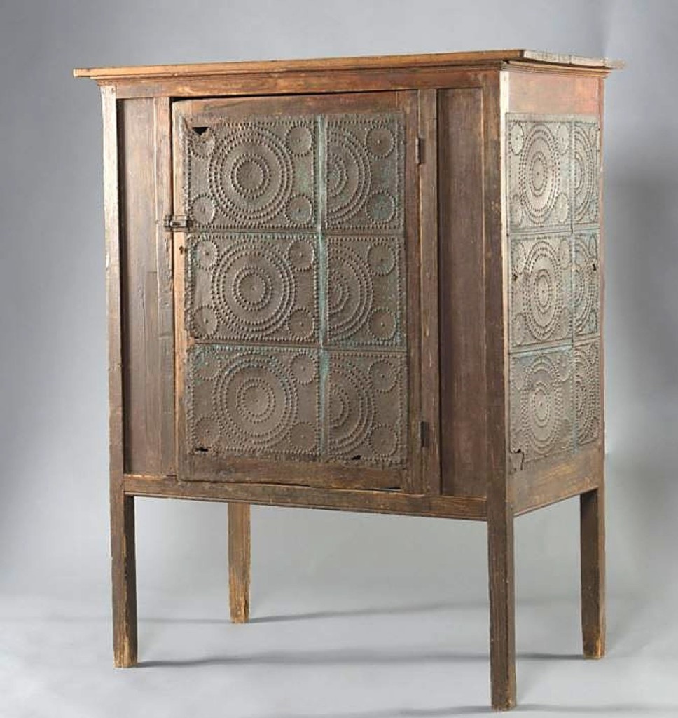 A pie safe collector acquired this example with a half-repeating tin sheet design to the door and side panels. Ledbetter said the pie safe came from South Carolina and it sold for $2,360.