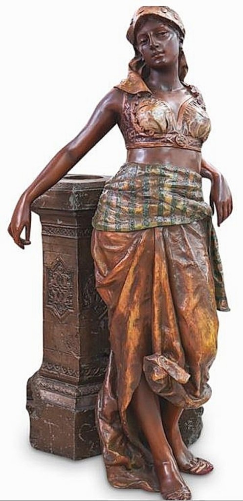 The large Orientalist polychrome statue brought $6,250. It featured a traditionally dressed exotic Middle Eastern maiden leaning against a decorative wall that had a hole for possible use as a jardiniere.