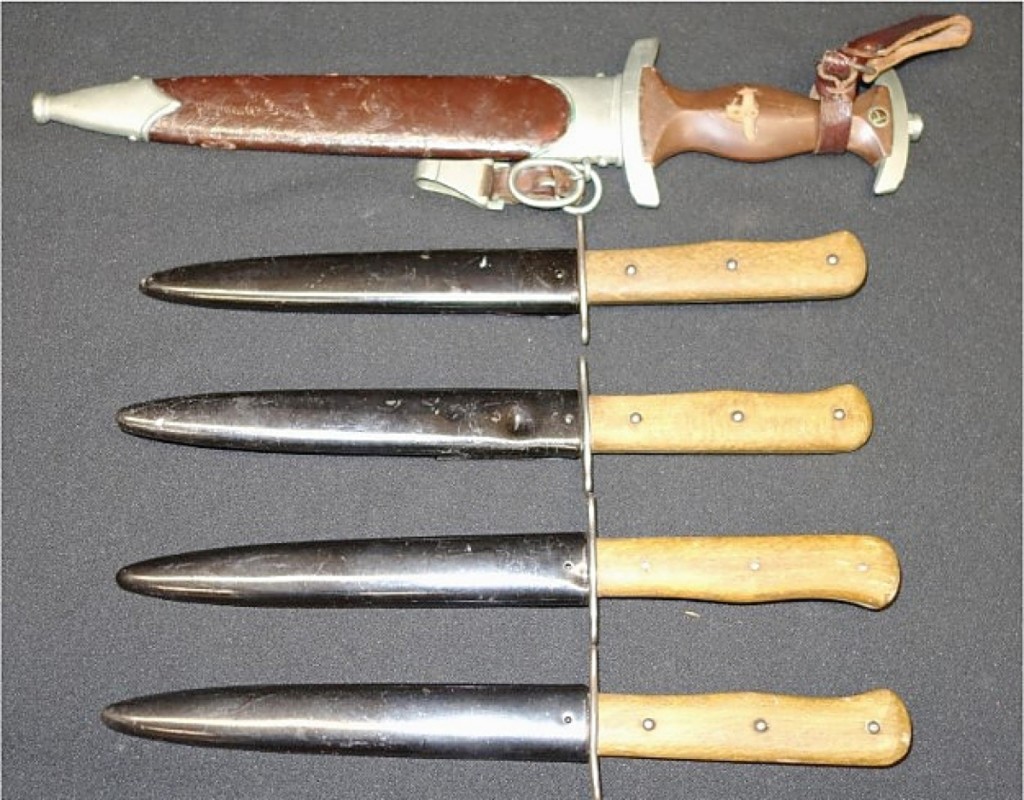 The second highest price in the sale was $780, for a group of five sheathed metal and wood daggers, including a German-Wolfertz example with leather-handle that was missing its emblem ($25/50).