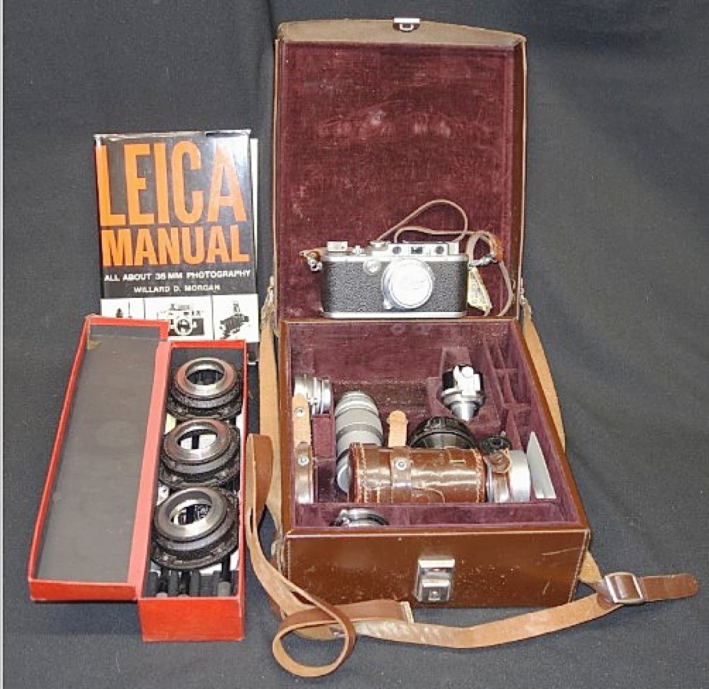 Leading the sale and closing for $960 was this leather-cased Leica camera, model #229182 that was accompanied by lenses, a tripod and other attachments and some pamphlets and a book ($200/400).