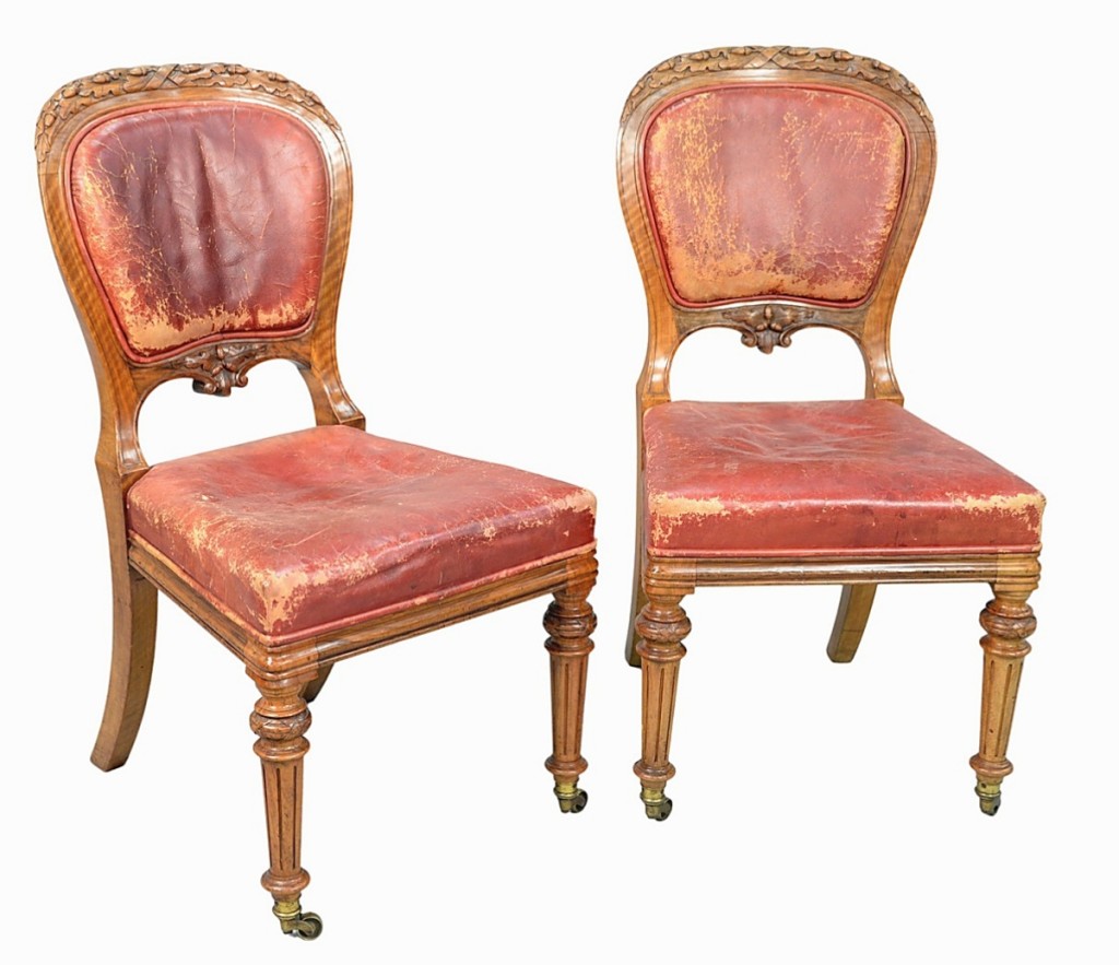 From the former Greenwich, Conn., home of actor Mel Gibson, a set of 24 Gillows Louis XVI-style walnut dining chairs with oak leaf carved backs and leather upholstered backs and seats (two shown) went out at $16,800.