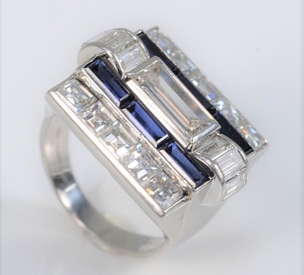 A Van Cleef & Arpels platinum diamond and blue sapphire ring, size 6½, commanded $25,200