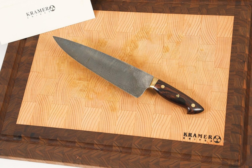 This 10-inch chef knife, custom made in the Damascus pattern by Bob Kramer, was offered with a Kramer cutting board as well as a copy of its original invoice. It sold for $6,250 ($5/7,000).