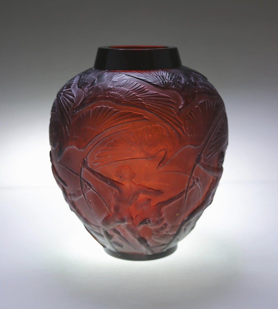 Bringing $5,625 from the same buyer as the Lalique “Sauterelles” vase was this Lalique amber and white stained “Archers” vase that had some condition issues ($2/4,000).