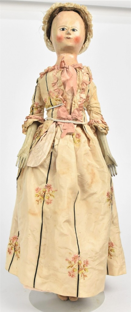 The sale’s top lot was this Queen Anne wooden doll from the early Eighteenth Century, 26 inches tall, that brought $9,680. It came from the collection of Lynne Dingus, a Midwestern antiques show promoter.