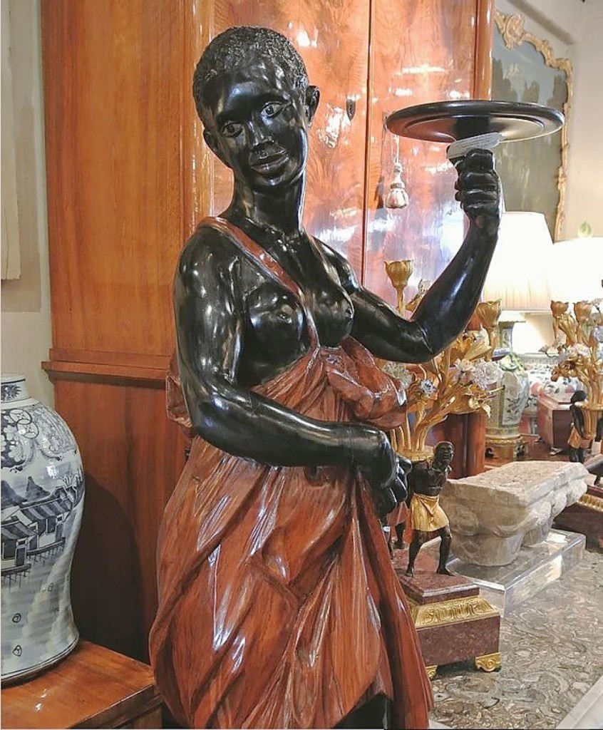 Female blackamoor candlestand, circa Eighteenth Century,   Villa Melrose Antiques, Los Angeles.