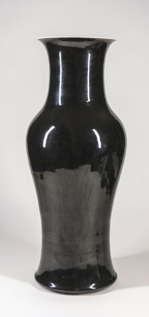 Of impressive size (17¼ inches) and with Kangxi underglaze blue six-character mark and of the period, a black-glazed vase went out at $5,120 to an online bidder.