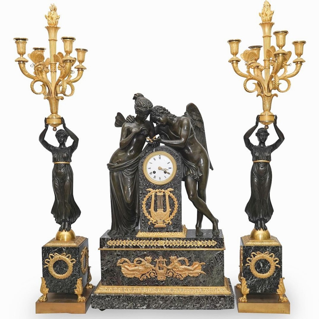 This French Empire marble and bronze mantel clock with a pair of four-light torchieres was based on an earlier model by Pierre-Philippe Thomire. A buyer in California paid $11,160 ($5/15,000).