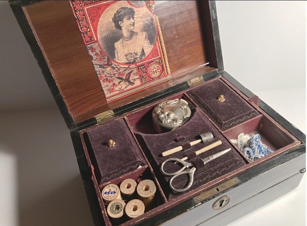 Victorian women were good multitaskers! Templeton Trading Post, La Grange Park, Ill., sold this dual-purpose black lacquered sewing box and writing desk that featured a lift-out tray with sewing tools and writing implements.