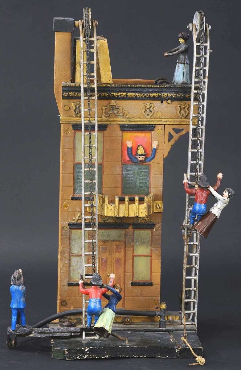 With two ladders and actions, the Deluxe Burning Building by the Carpenter Company is rare. The Schroeders had purchased it from a Pennsylvania dealer who acquired it from a descendant of the Carpenter family. It sold for $66,000. The firm wrote, “They allegedly assembled the toy at the factory on Jan 2 1906, and the owner signed such on the front of the building. This is the only example we are aware of which was assembled at the appropriate period and therefore the most authentic example of the elusive toy.”