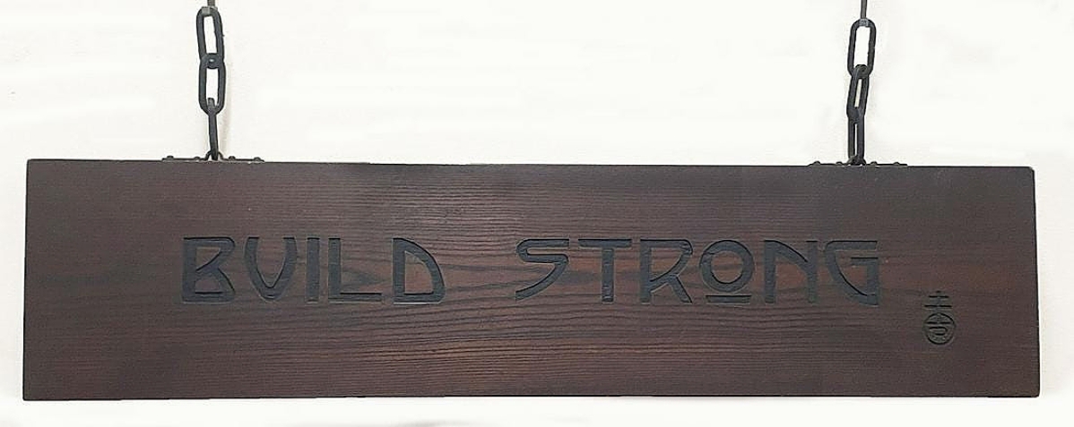 Roycrofter signs usually sell in the $1/1,500 price range and that’s how this one was estimated. But those signs are usually on typical double-sided boards. However, the back of this one, worded “Build Strong,” was rough — the bark was still on it, and that drove the final price to $25,620.