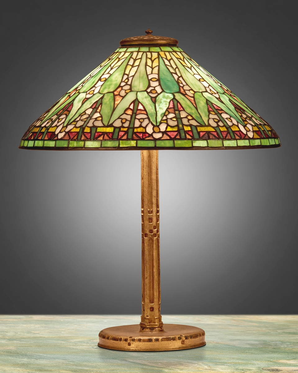 A Tiffany Studios “Arrowroot” table lamp was the top lot, realizing $42,250. “A pretty iconic form,” said head of sale Maranda Moran, “with an Arts and Crafts aesthetic as well as some Art Nouveau. The glass in it was lovely. It’s a form that was made in a variety of different colors, and this one was just right on with the green shoots and background color.”
