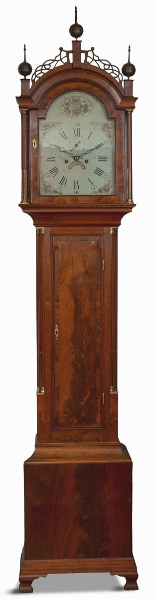 Made by Concord, Mass., clockmaker Daniel Munroe, with the case stamped by his brother Nathaniel, the tall case clock had remnants of a paper label. Also signed on the dial, it went out for $9,360.
