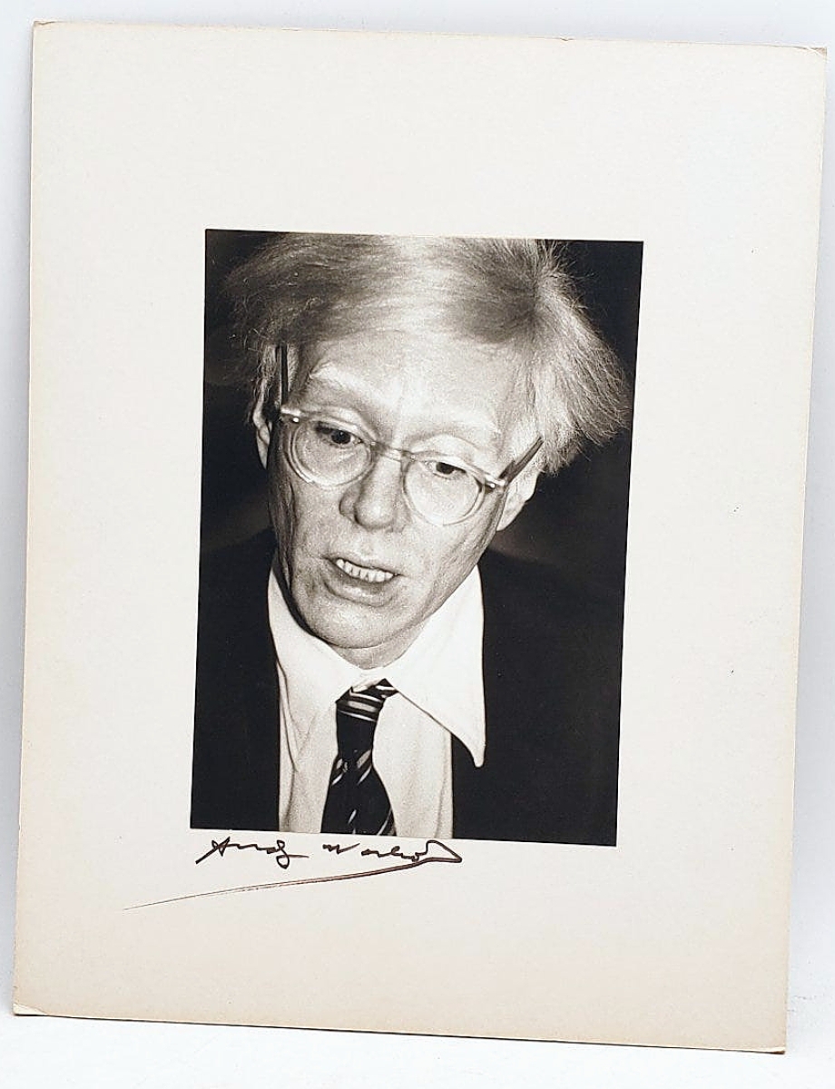 The second highest price in the sale was $2,200 paid for this photograph of Andy Warhol with signature on artist board beneath it.