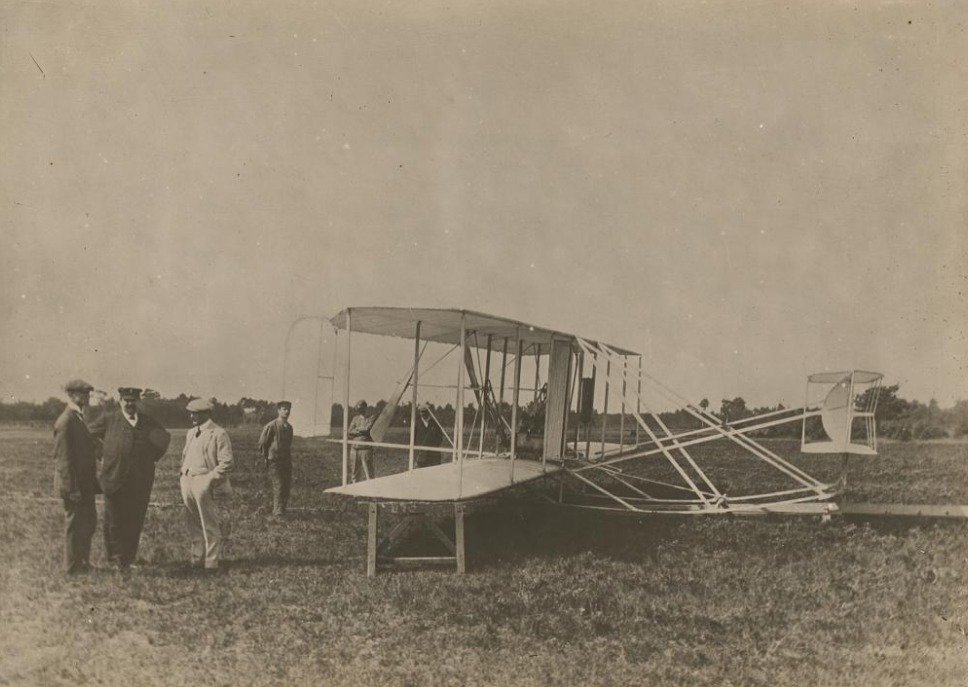 Wilbur Wright and his glider seen in a 1908 photo by Léon Bollée, (1870-1913). National Portrait Gallery, Smithsonian Institution.