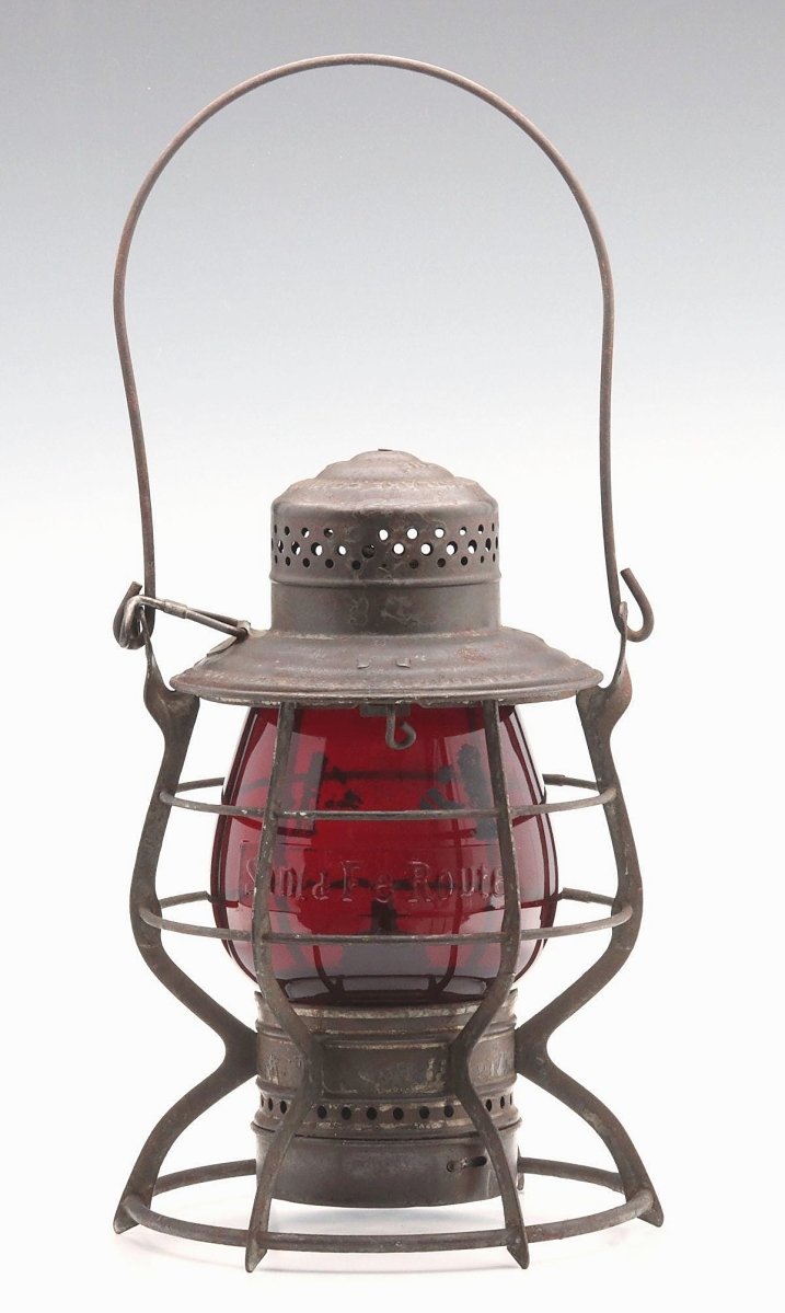 At $15,400 was this Santa Fe Route lantern with red globe. The letter U in “route” is cast backwards with the tail facing the wrong way. It was made by the Adams & Westlake Company.
