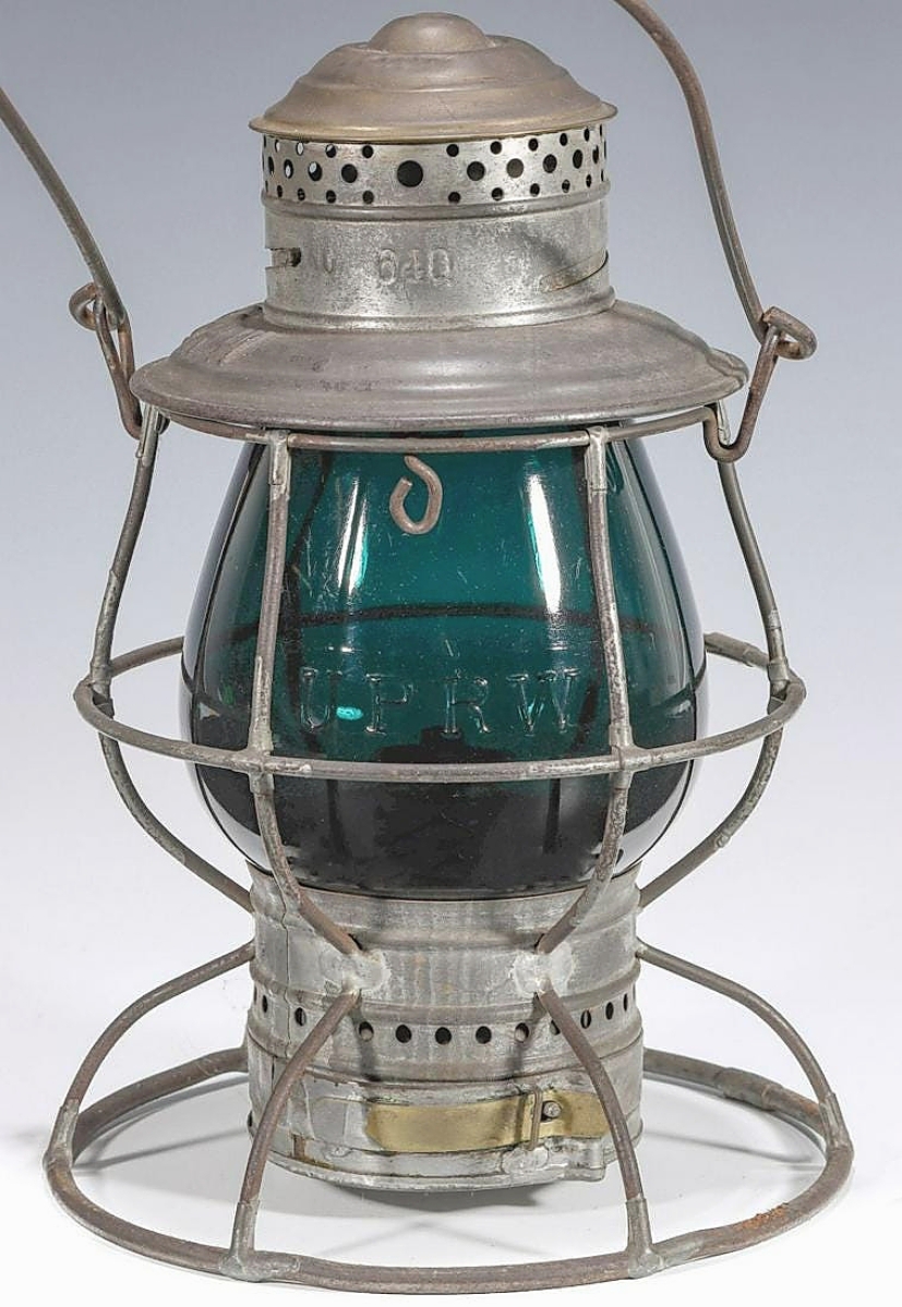 The fourth highest lantern in the sale was $16,500 paid for a green globe with cast lettering “U.P.R.W.” It was housed in a brass top wire frame by Adams & Westlake.