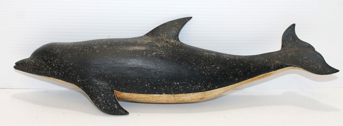Signed by the well-known Vermont carver Clark Voorhees, this wooden and painted dolphin, 18 inches long, earned $1,968.