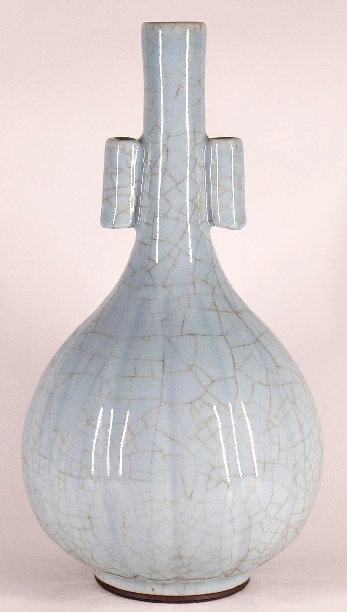 Provenance to a scholar of Chinese art was one of the selling points of this large Guan-type celadon arrow vase with Yongzheng mark that dated to the late Eighteenth or early Nineteenth Century. A buyer from Massachusetts pushed bidding to $10,240 ($7/10,000).