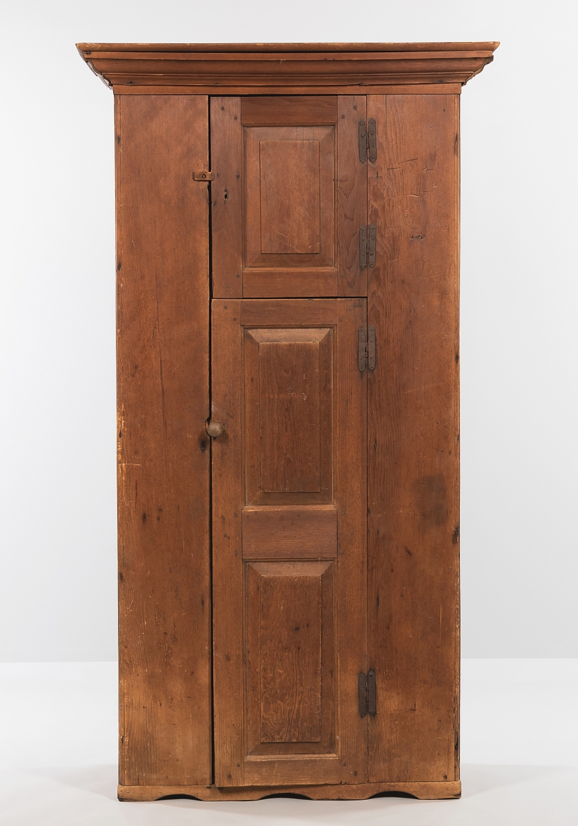 At $11,875, nearly three times the estimate, an Eighteenth Century pine cupboard with two paneled doors and hinges that were probably original, was one of the pieces with a mellow, original, weathered patina. Just over 6½ feet tall, it probably originated in New Hampshire.