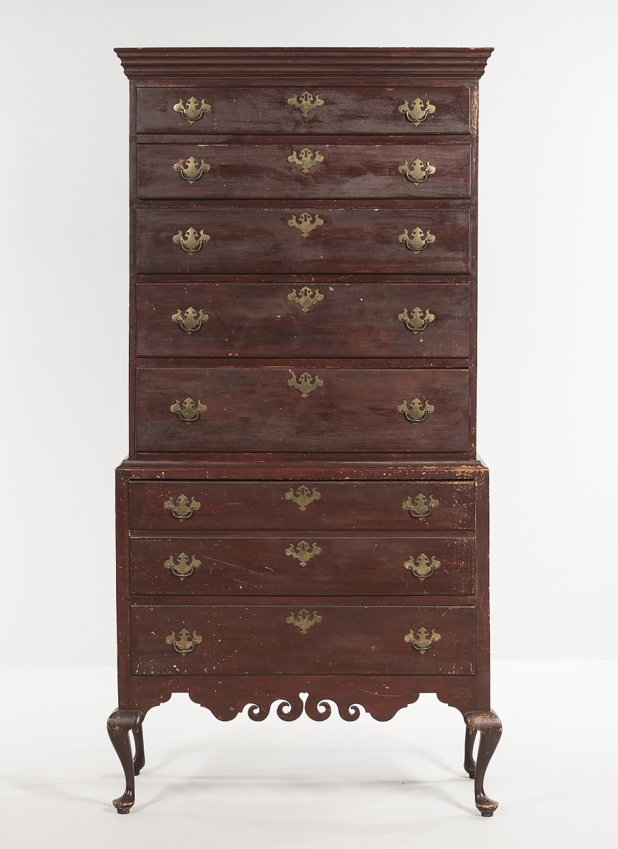 Bringing $25,000, this circa 1780-1800 Dunlap chest-on-chest had a flat molded cornice above five graduated drawers, and the lower section had two drawers. Attributed to Samuel Dunlap, the cabriole legs ended in pad feet and it had a heart scroll valance, typical of the Dunlap school. It was cataloged “with minor imperfections.”
