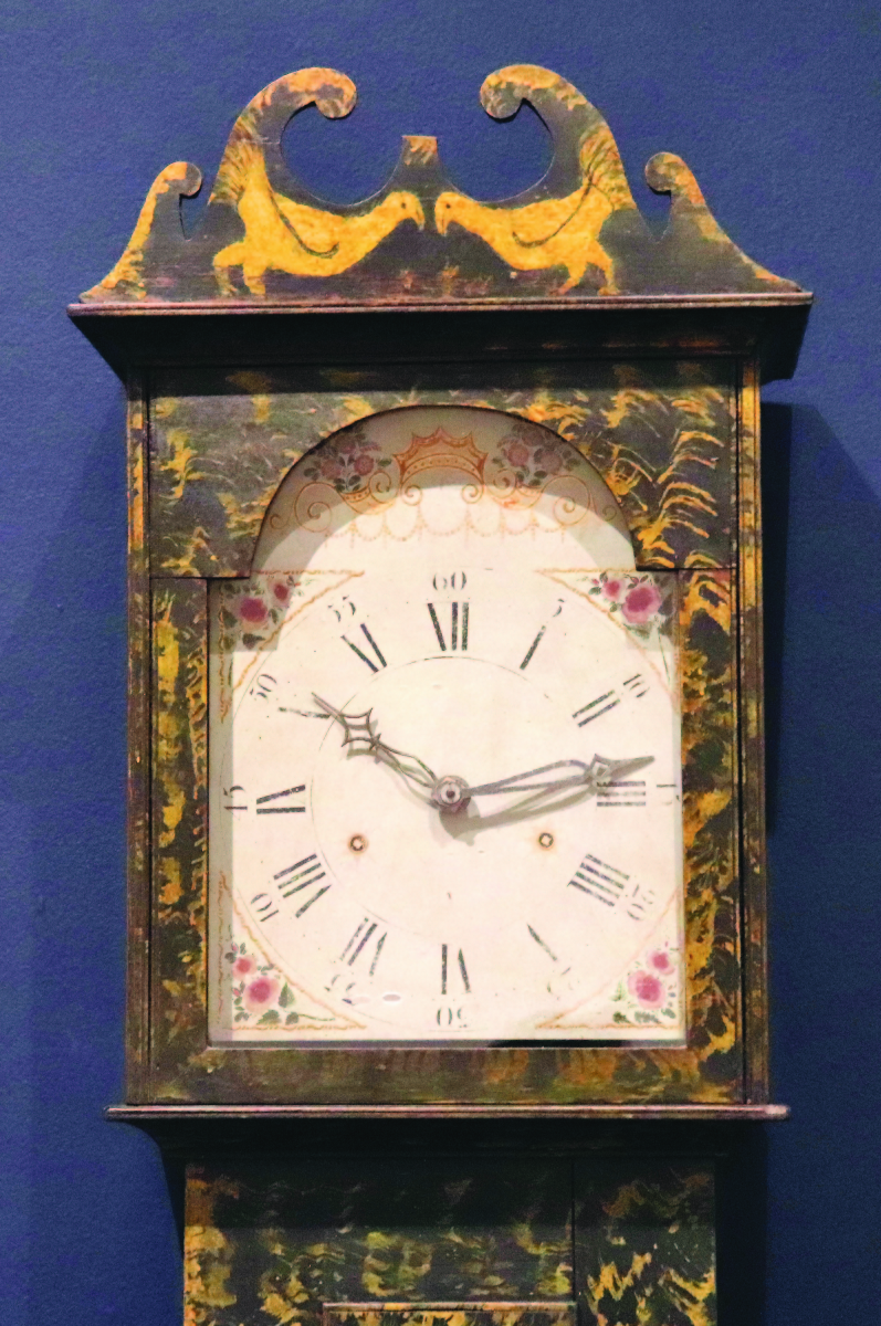 Tall case clock with birds (aka Chicken Clock), possibly Washington County, circa 1820. Poplar with chrome yellow and black paint, clock movement by Asa Hopkins, Litchfield, Conn.