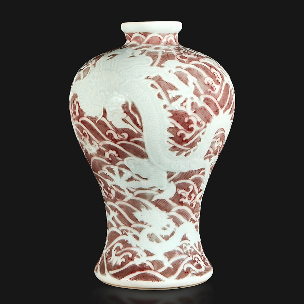This carved and underglaze red “dragons and waves” vase, Meiping, Yongzheng six-character mark and period brought the top price of the sale. It stood 11- inches tall and had been in the collection of Sheelah M. Langan (1910-1993); it sold to a phone bidder who prevailed against several other phone bidders, for $2,316,000 ($150/250,000).