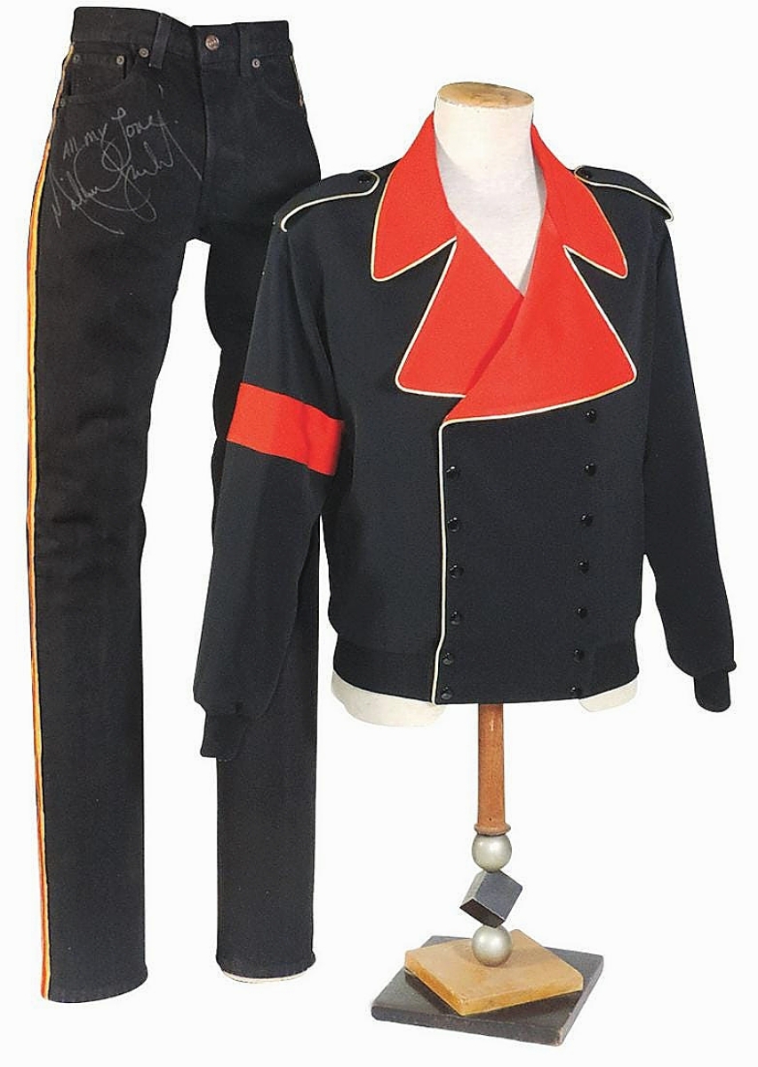 Michael Jackson’s personally owned, worn and signed two-piece ensemble, with double-breasted black wool jacket with wide red lapels and epaulettes, embellished with gilt piping, garnered $7,380.