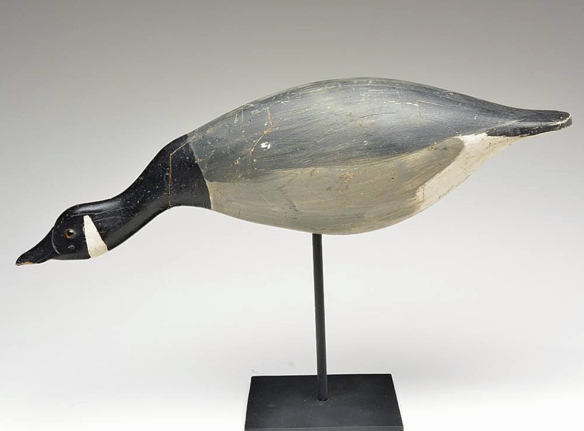 A hollow-carved reaching Canada goose decoy, one of several Canada geese in the sale, sold for $60,000. The laminated decoy was made by John Tax of Osakis, Minn.