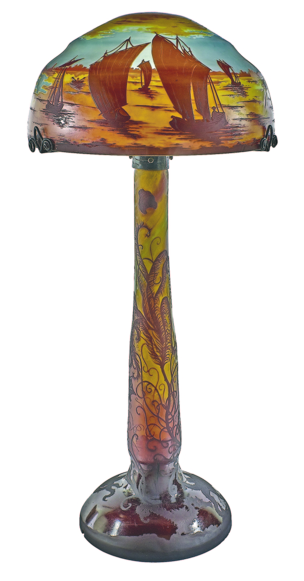 From Daum came this cameo cut glass lamp, 33 inches high with a scene of boats in a harbor. It sold for $15,600.