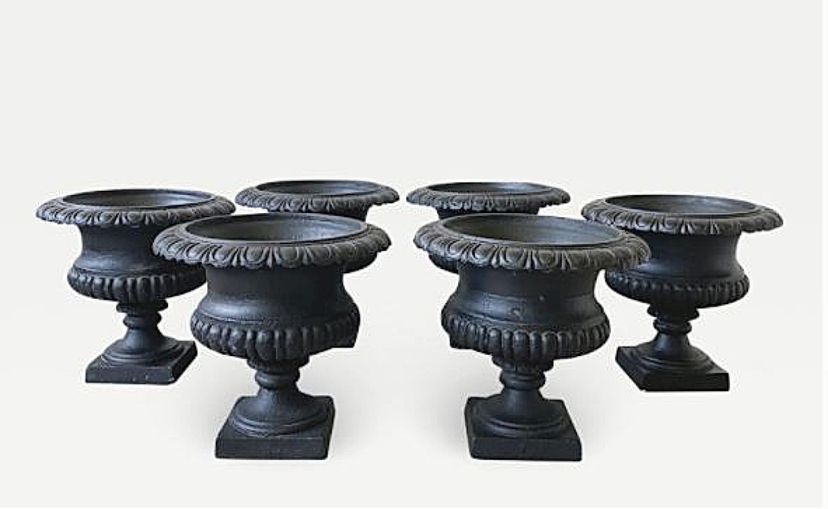 A set of six black cast iron New York hotel urns were on offer for $1,475 at New York City dealer Van Royen Antiques.