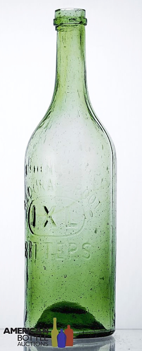 Selling for $4,200 was a Dr Henley’s Wild Grape Root IXL Bitters bottle in a light green color. Wichmann said it was among the finest examples of this bottle that he had ever seen and he graded it a 9.