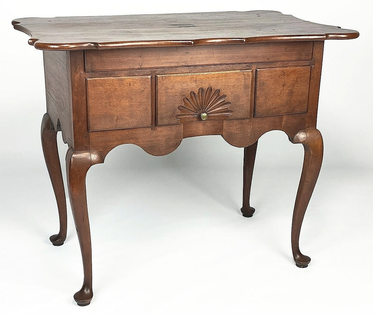A Queen Anne scalloped top dressing table, probably from Wethersfield, Conn., led the selection of American furniture, both in terms of dollars achieved, $40,260, and in presale interest. Scalloped top examples are exceedingly rare, with perhaps fewer than a dozen examples known.